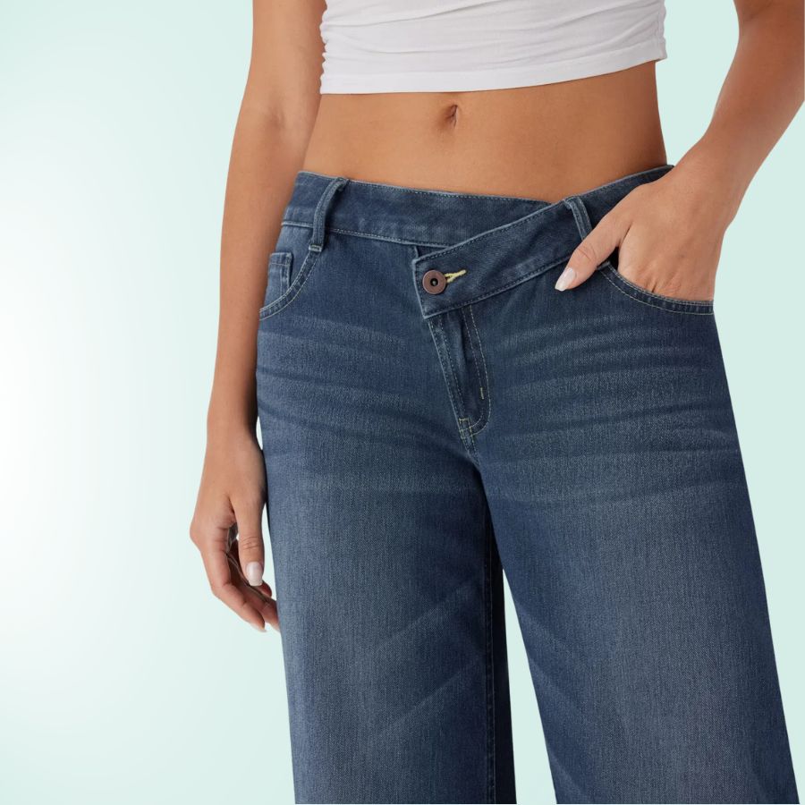 Vaqueros mujer asimétricos, tiro bajo, pierna ancha. Tejido elástico azul denim look casual.