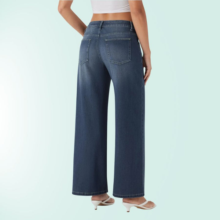 Moda femenina con vaqueros elásticos mujer, tiro bajo asimétrico. Azul denim y comodidad.