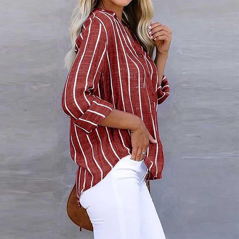 Blusa de rayas moderna para mujer, manga larga, con práctico bolsillo, esencial para la moda de primavera.