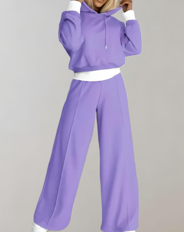 Sudadera cropped moderna para mujer combinada con pantalón de pierna ancha, estilo urbano y versátil.