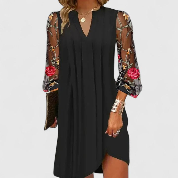 Vestido mini floral negro elegante para mujer con mangas largas, ideal para cóctel o noche de primavera.