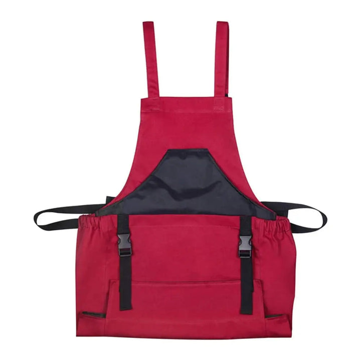 Delantal de tela Oxford para jardinería. Diseño unisex con tirantes cruzados y bolsillos para herramientas y accesorios.