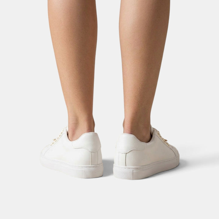 Zapatillas ortopédicas de mujer que mejoran la postura, con diseño ergonómico y soporte avanzado para los pies.