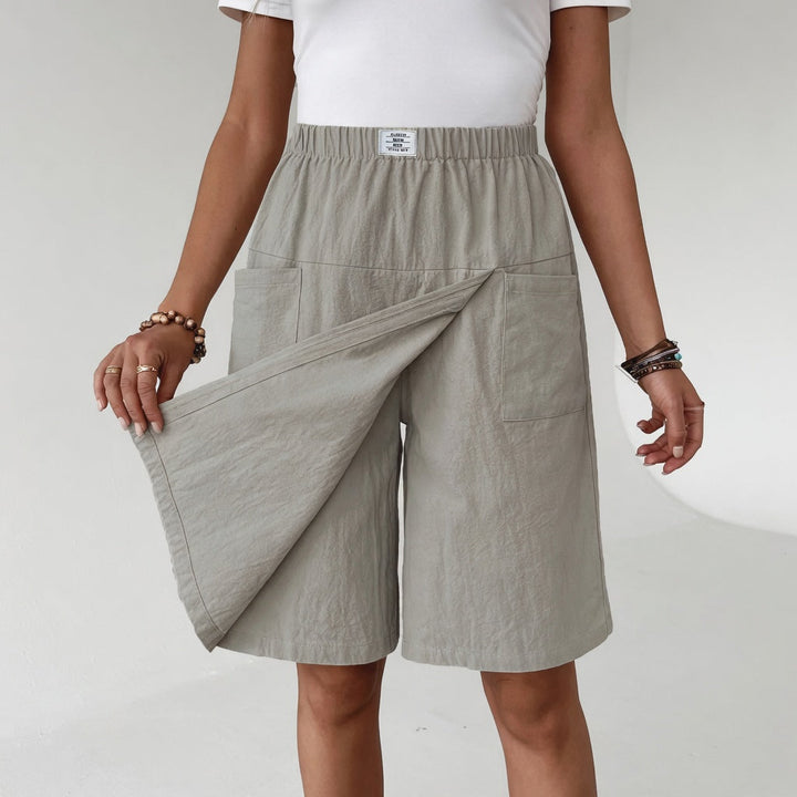 Falda pantalón de mujer casual con cintura elástica y bolsillos, ideal para primavera/verano, comodidad y estilo.