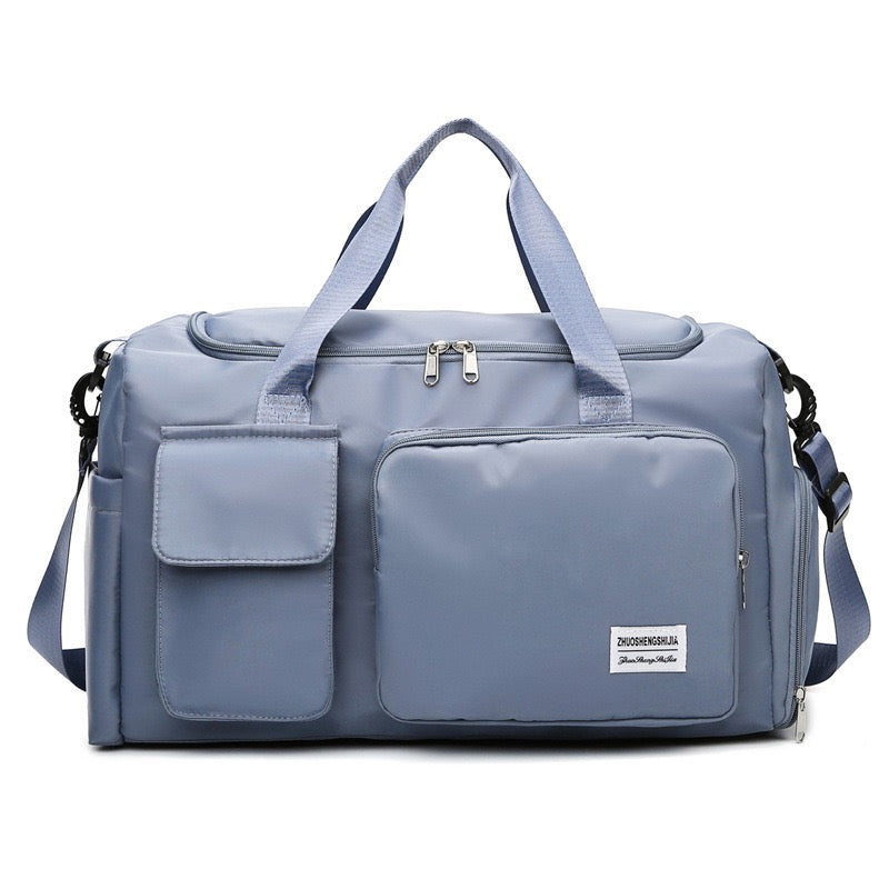 Bolsa de viaje multi-bolsillos, ideal como maleta de mano para vuelos y escapadas.