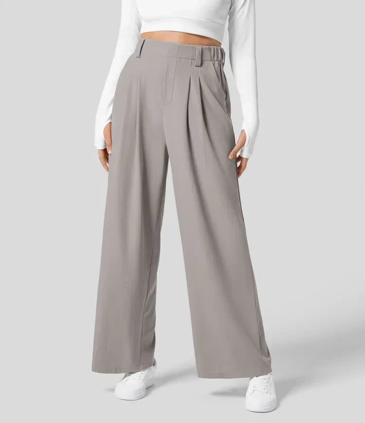 Pantalón de oficina femenino, talle alto y pernera ancha, estilo elegante.