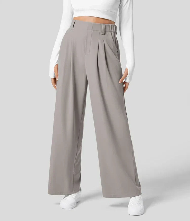 Pantalón de oficina femenino, talle alto y pernera ancha, estilo elegante.