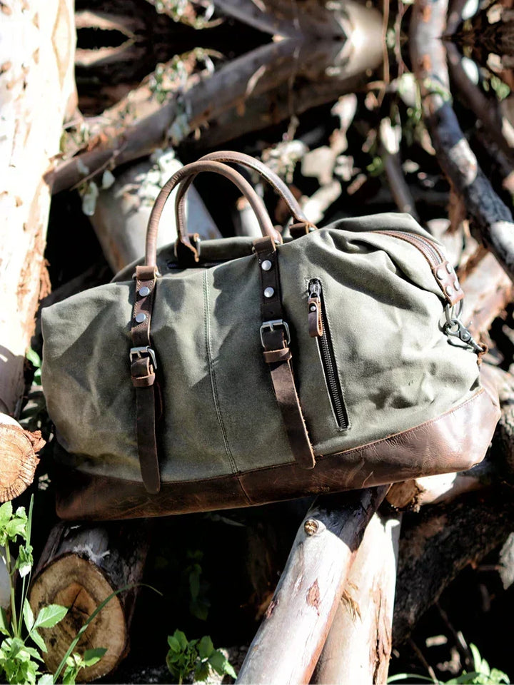 Bolso weekender de lona duradera, amplio compartimento para equipaje, ideal para viajes y deporte.