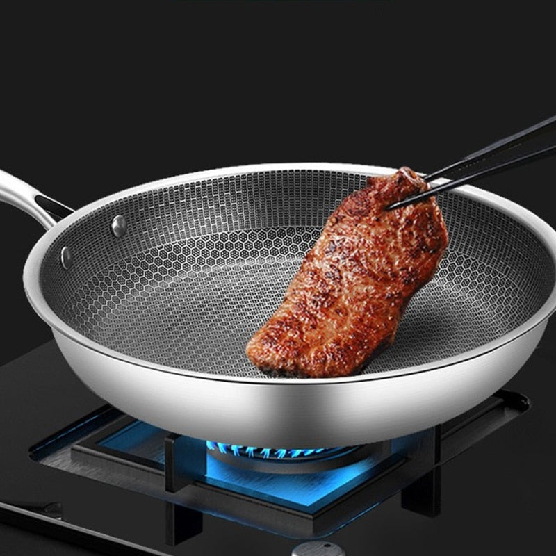 Sartén antiadherente de acero inoxidable premium, resistente a arañazos, ideal para cocina moderna.