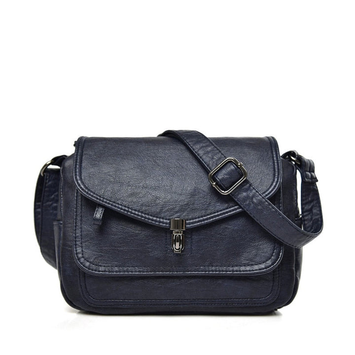 Mujer llevando bolso bandolera compacto ajustable, cómodo y práctico para salidas diarias.
