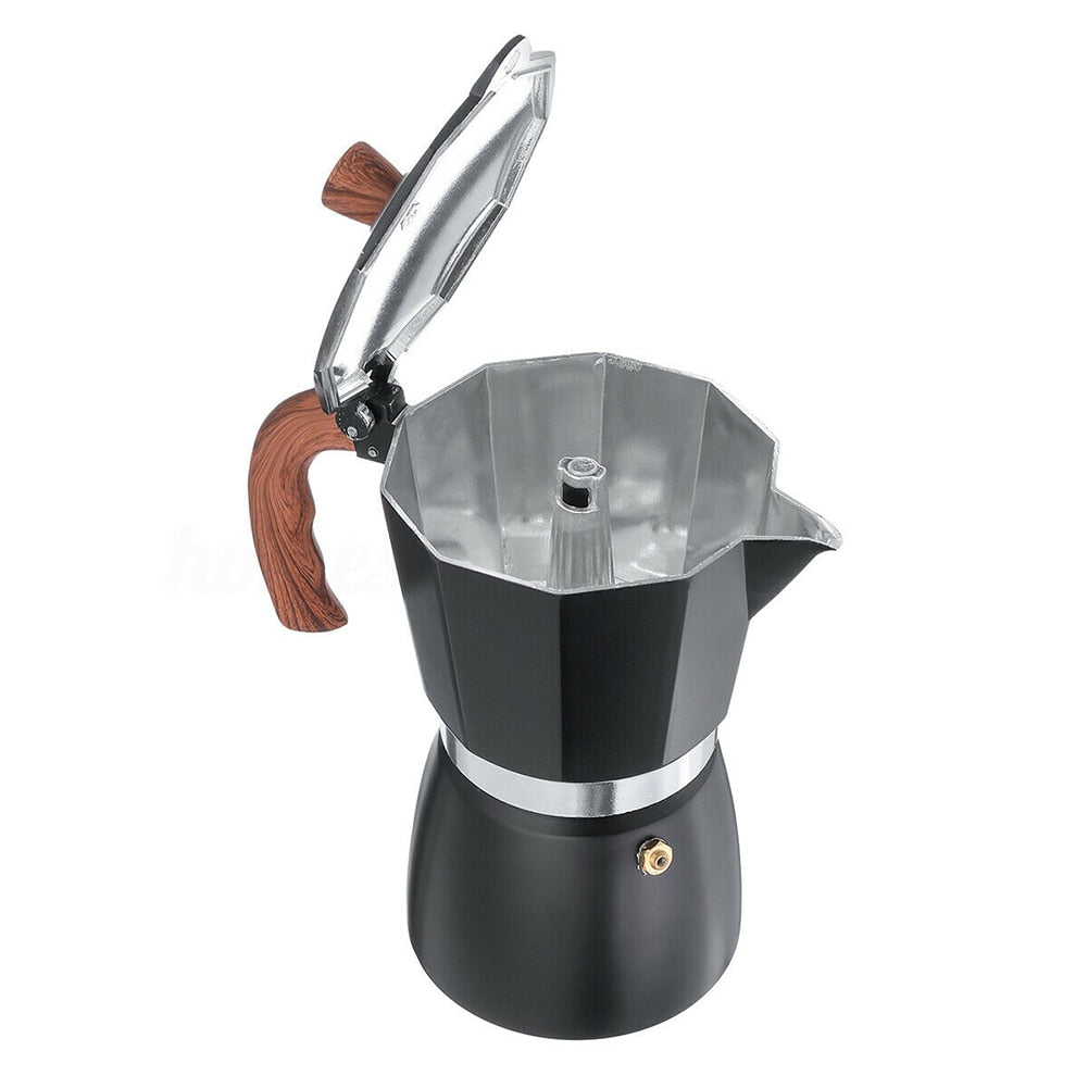 Elegante cafetera espresso negra de aluminio, portátil para disfrutar café en casa.