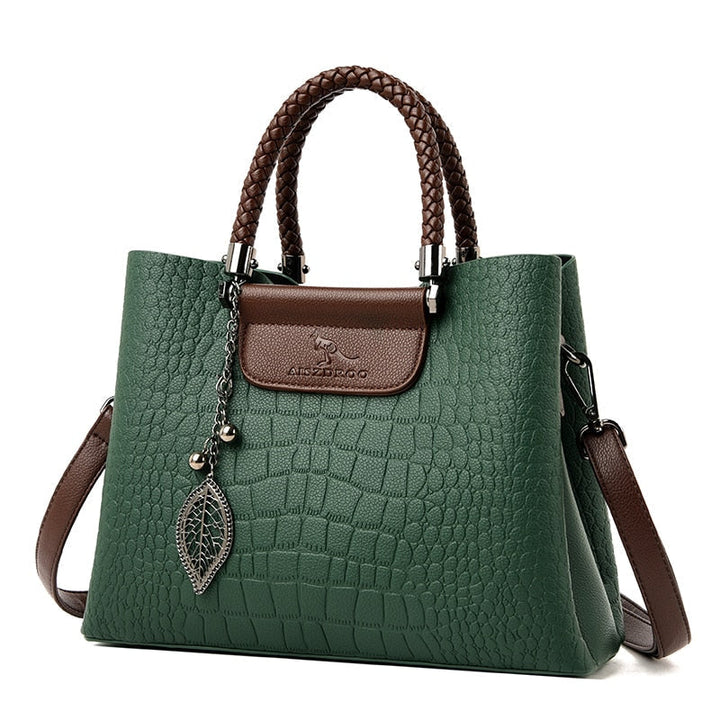 Elegante bolso de cuero para mujer con correa ajustable, accesorio de moda.