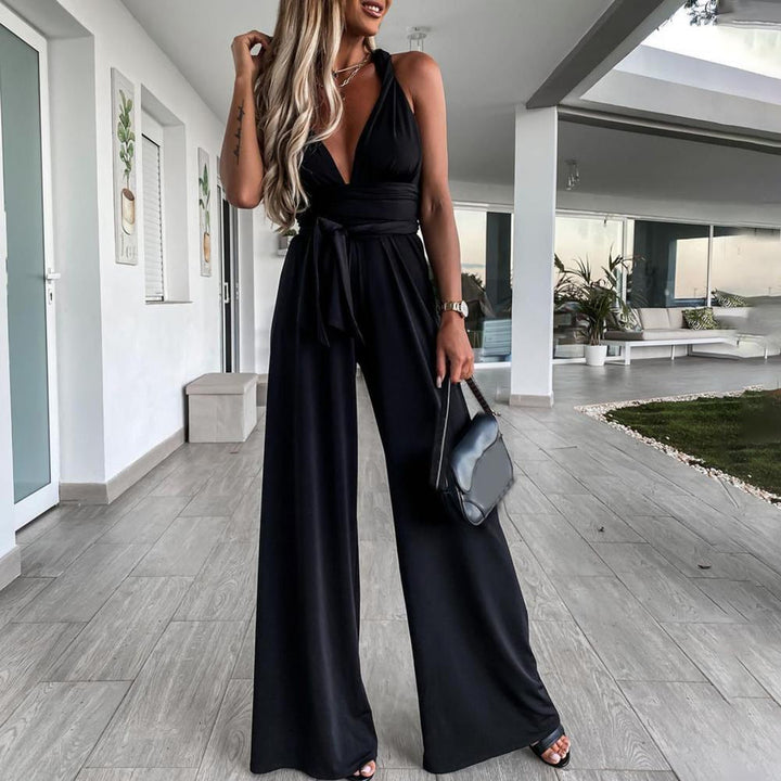 Mono ancho elegante de mujer. Escote cruzado, pierna fluida y caída sofisticada. Ropa femenina de tendencia.