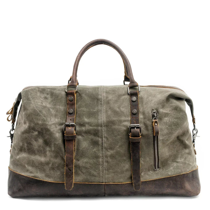 Bolso de viaje weekender de lona, resistente al agua, lleno y listo para tu próxima aventura.