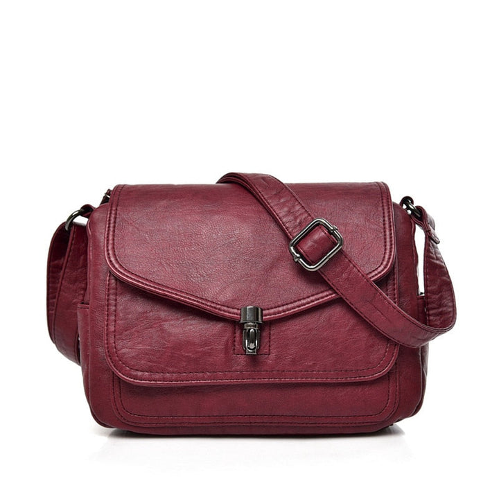 Bolso bandolera minimalista para mujer, diseño atemporal, compacto y elegante, ideal para un look chic.