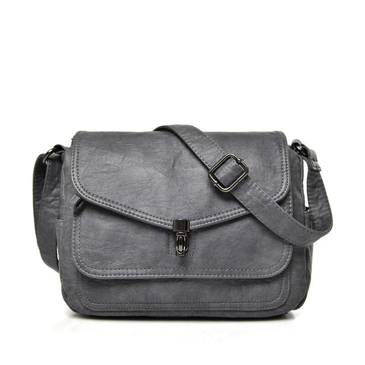 Bolso de mujer ajustable y compacto, ideal para viaje o uso diario, estilo moderno y versátil.