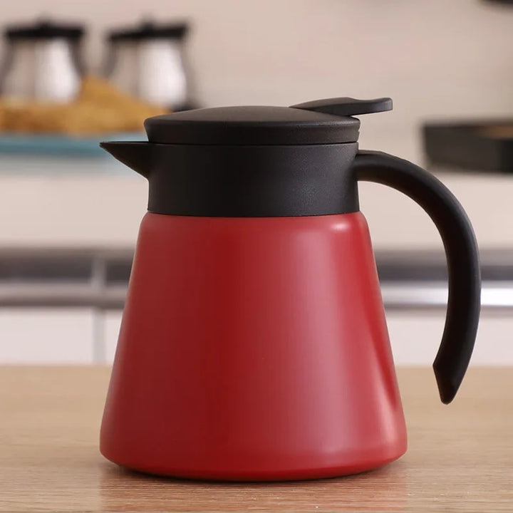 Jarra térmica de acero inoxidable aislada al vacío para café y té. Mantiene bebidas calientes o frías.