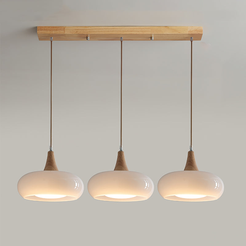 Colgante de techo estilo nórdico, cristal ámbar y madera, crea luz cálida para el hogar.