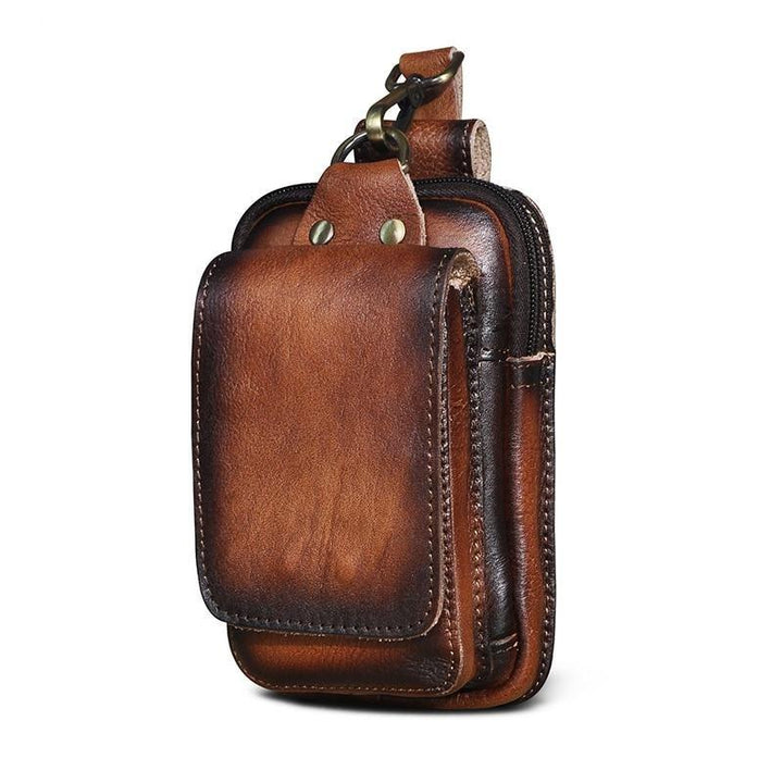 Riñonera de cuero sintético marrón para hombre, diseño moderno, perfecta para un look casual urbano.