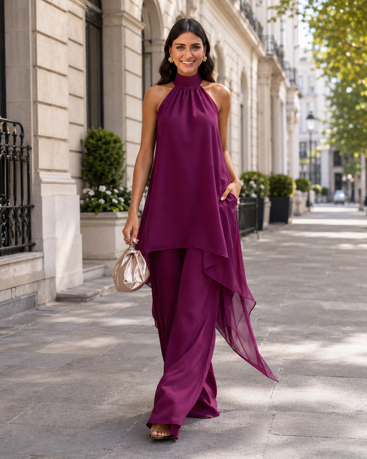 Detalle del top palabra de honor y pantalón palazzo morado, parte del conjunto elegante de fiesta para mujer.