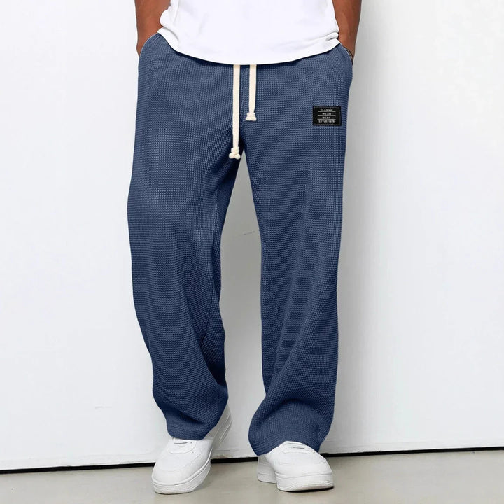 Pantalón de corte ancho y relax, casual con cintura ajustable, perfecto para el verano y la moda.