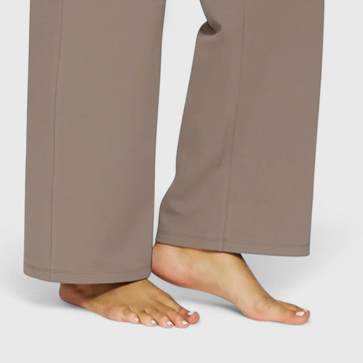 Elegante pantalón ancho mujer, tiro alto y elástico. Versátil para primavera, con bolsillos útiles.