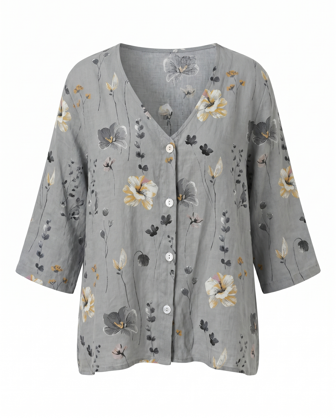 Mujer vistiendo blusa floral bordada de cuello V, ajuste relajado. Moda casual de verano.