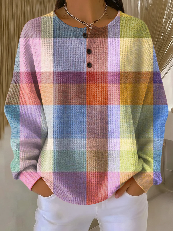 Camisa de mujer con rayas y manga larga, en tejido suave de punto waffle. Estilo casual y elegante.