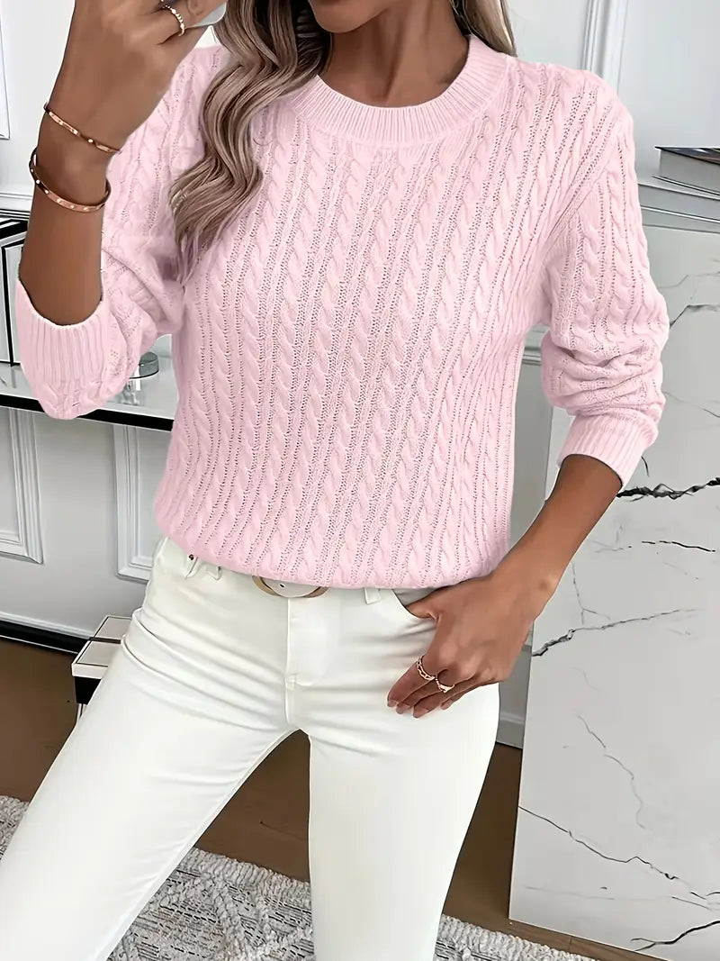 Jersey de mujer en tejido trenzado, cuello redondo. Una prenda de punto versátil para tu armario.