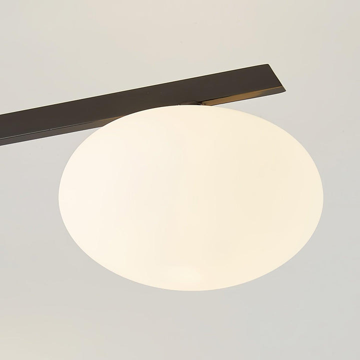 Lámpara de techo minimalista de vidrio y cobre, crea un ambiente acogedor con luz LED.