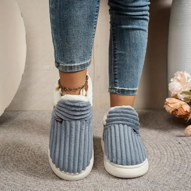 Zapatillas de hogar unisex, cálidas y cómodas, con suela antideslizante para días fríos.