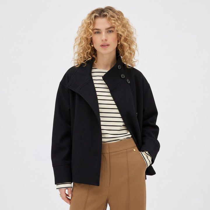 Abrigo ligero azul oscuro para mujer, chaqueta corta versátil con cuello alto y botones frontales.