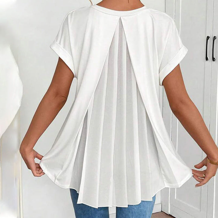 Blusa de dama versátil, escote V, manga doble. Prenda suelta y cómoda para el día a día.