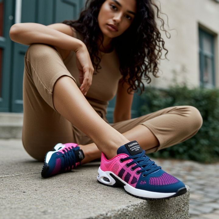 Zapatillas deportivas de mujer con suela amortiguada, disponibles en negro, rosa, lila. Mesh transpirable y cordones.
