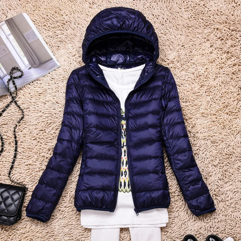 Abrigo plumífero de mujer para invierno, ultraligero y versátil para actividades.