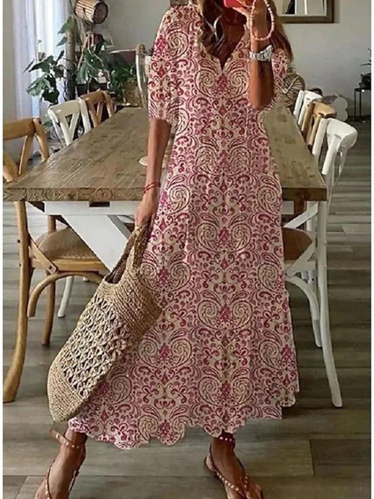 Estampado floral vibrante del vestido maxi elegante y fluido para mujer, ideal para primavera-verano.
