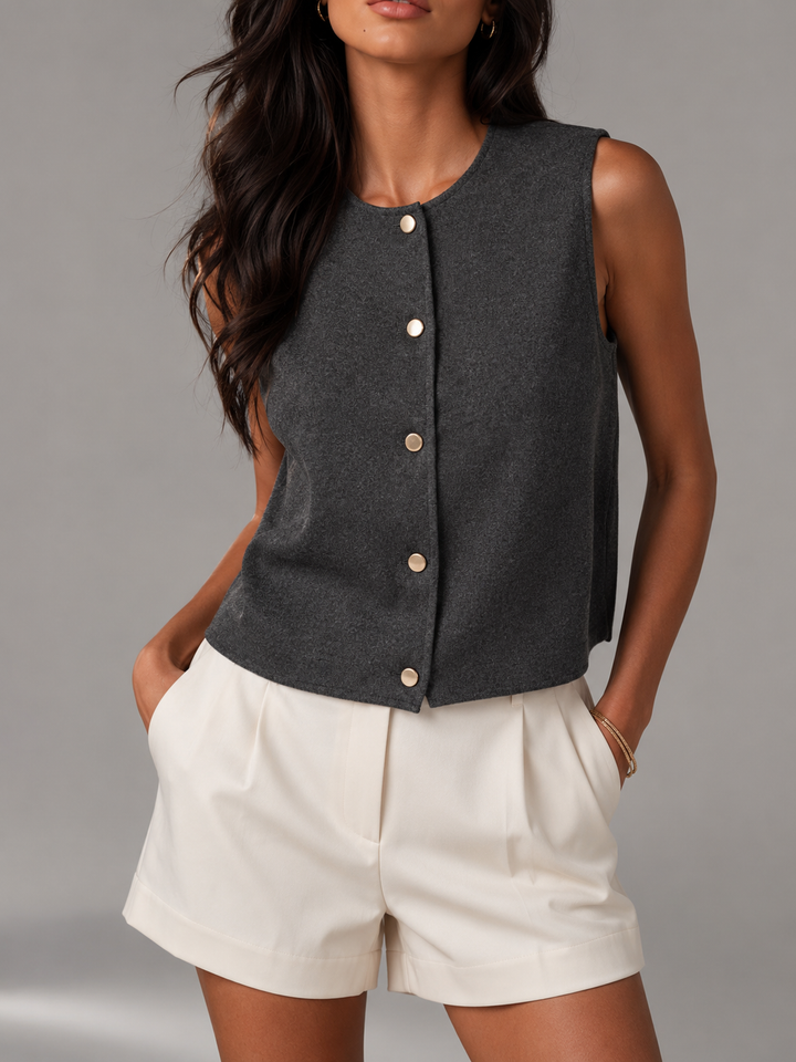 Chaleco cropped elegante mujer, botones dorados. Estilo moderno, sin mangas, ideal primavera/verano.