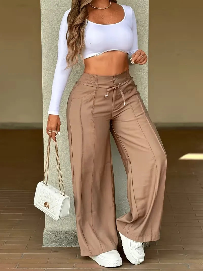 Pantalones de tiro alto para mujer, corte pierna ancha, ideal para un estilo relajado y chic.