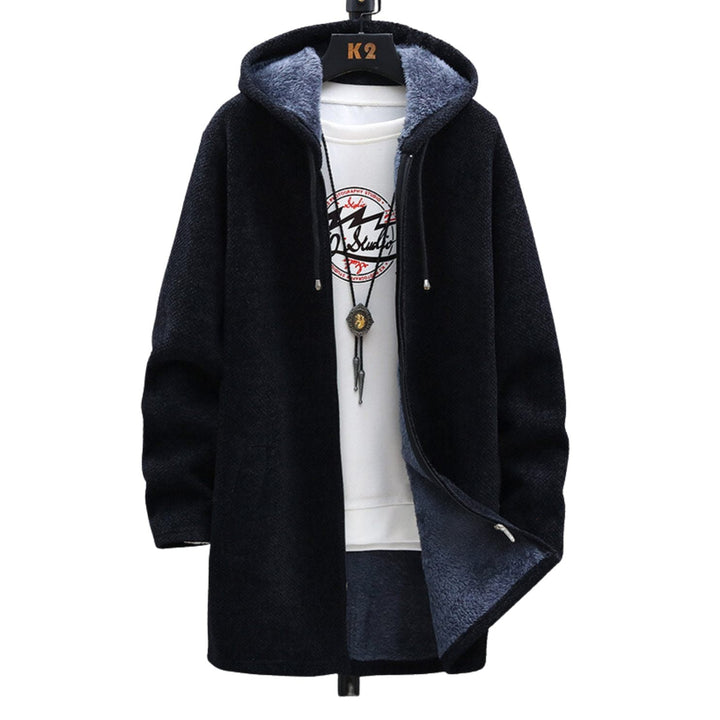 Abrigo de mujer largo con capucha y cordón. Diseño casual moderno, ideal para comodidad y estilo en entretiempo.