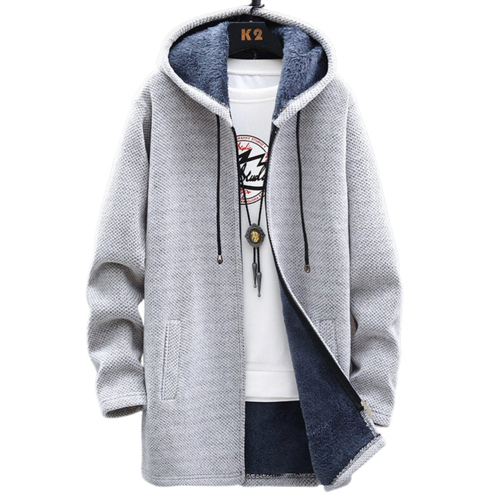 Abrigo de mujer con capucha y cordón ajustable, diseño largo y casual. Comodidad y moda versátil para la calle.