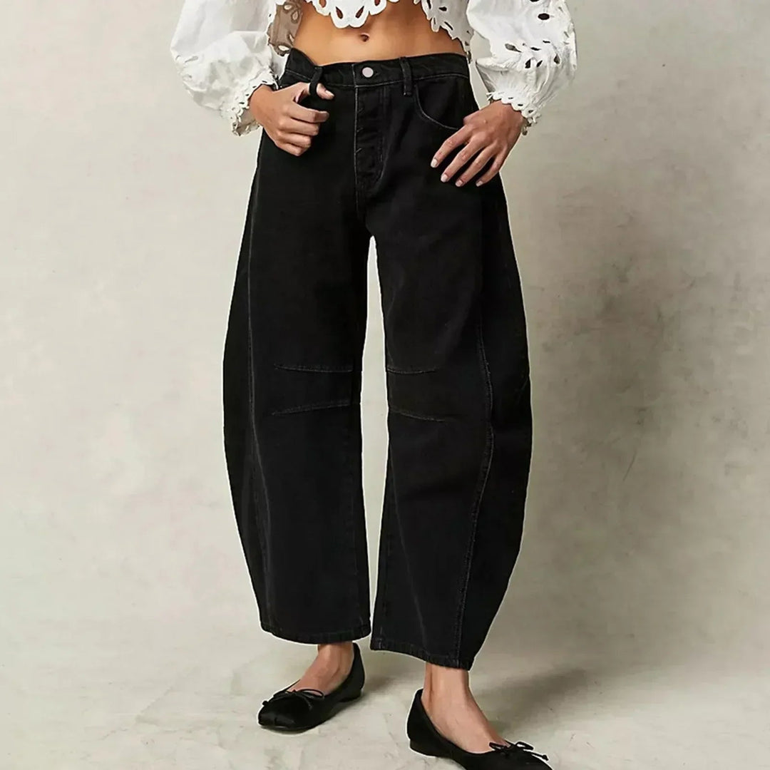 Pantalón vaquero ancho y fluido para mujer, de tiro alto, ofrece comodidad y un estilo moderno.