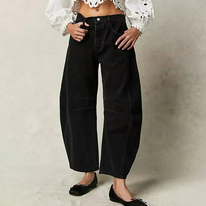 Pantalón vaquero ancho y fluido para mujer, de tiro alto, ofrece comodidad y un estilo moderno.