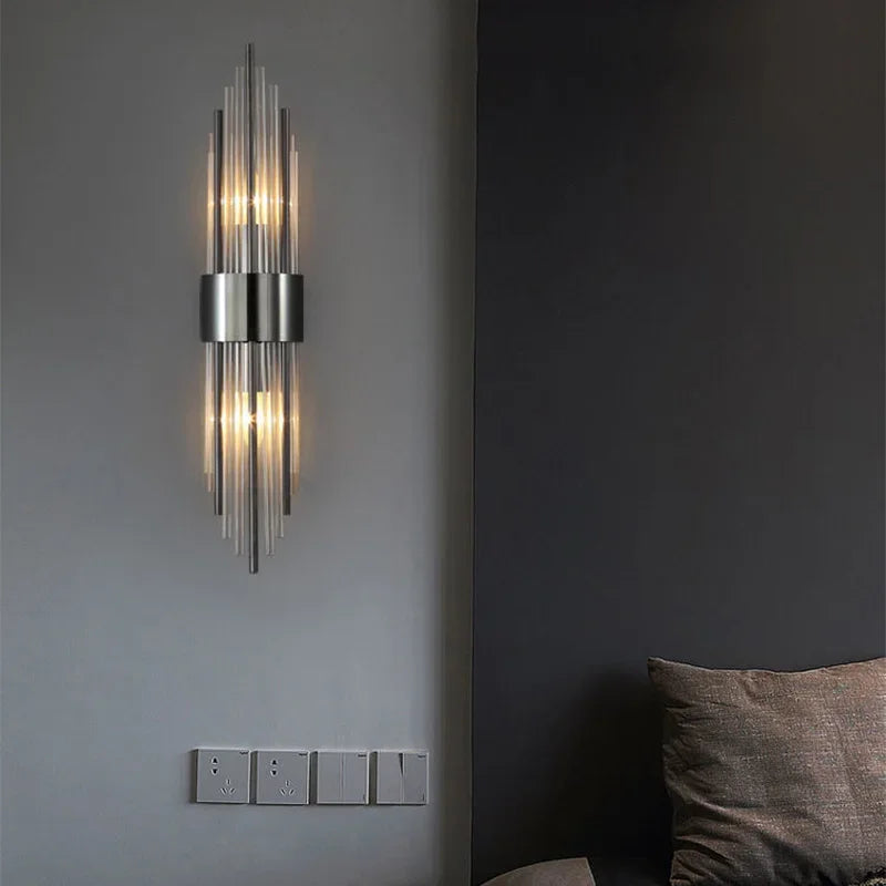 Aplique de pared LED de cristal y acero inoxidable, luz cálida para decoración de interiores.