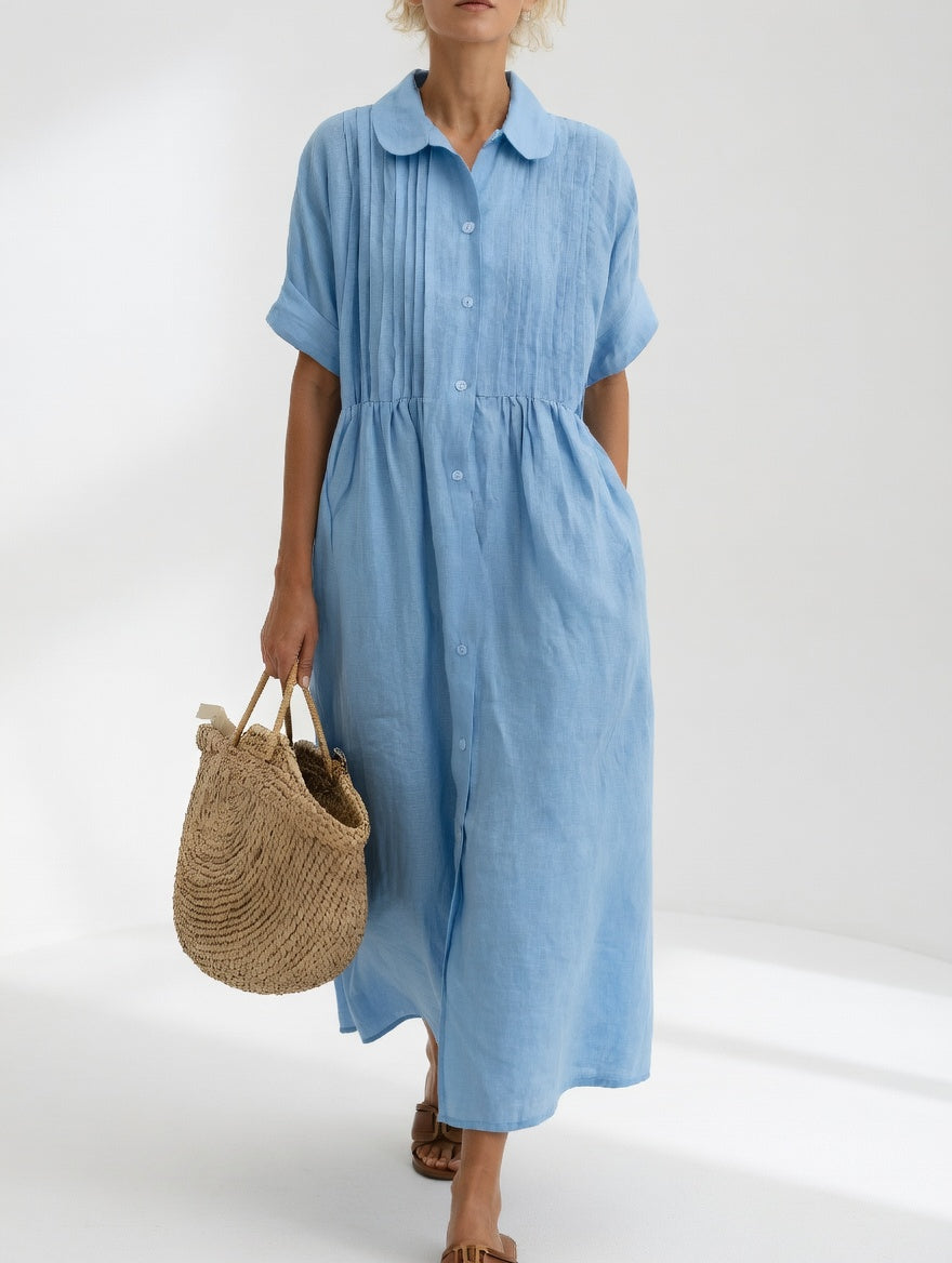 Vestido camisero de verano fluido para mujer. Diseño elegante y transpirable, perfecto para un look casual y fresco.