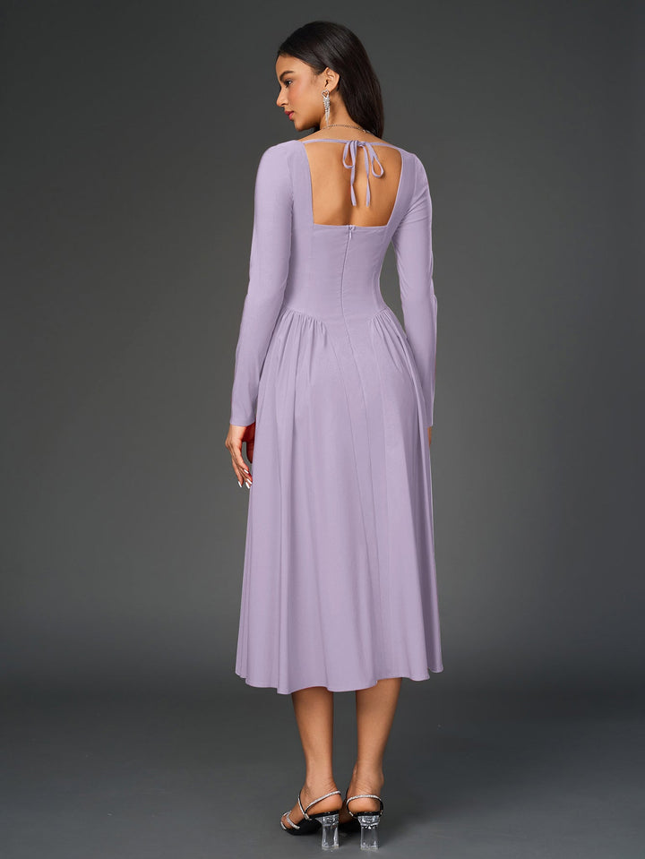 Vestido mujer línea A, manga larga, lazo espalda; estilo atemporal y sofisticado.