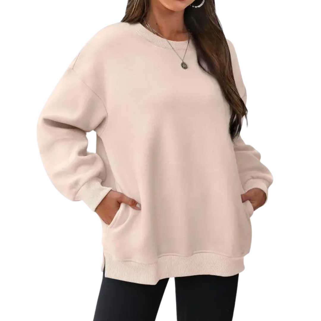 Sudadera oversize para mujer con cuello redondo, manga larga y bolsillos. Estilo versátil y muy cómoda.