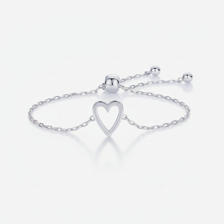Pulsera dorada de cadena con corazón, ajustable para él y ella. Accesorio minimalista unisex, regalo ideal para parejas.