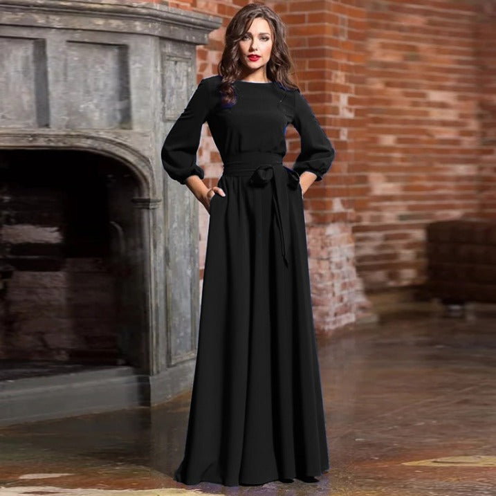 Detalle de vestido de fiesta formal con mangas largas, ideal para bodas, ceremonias y eventos especiales.