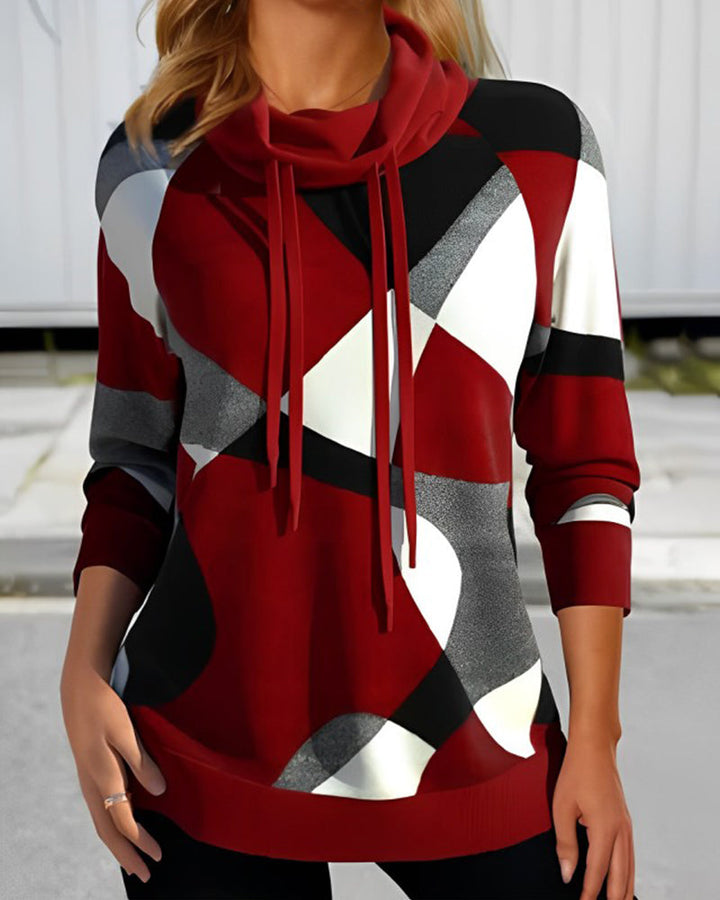 Sudadera con capucha geométrica para mujer en tonos rojo, azul y gris. Ideal para moda casual de invierno.