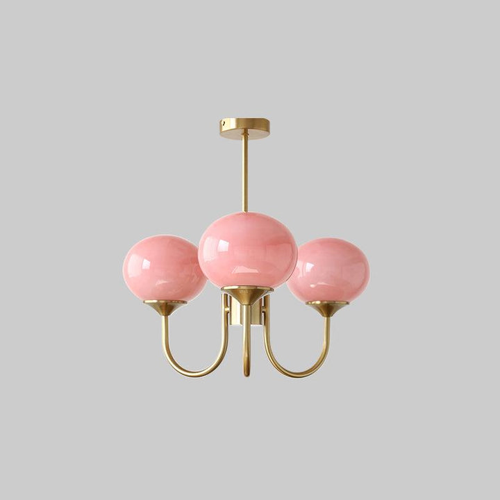 Decoración de interiores: araña Alora Marshmallow, cristal rosa y detalles dorados.